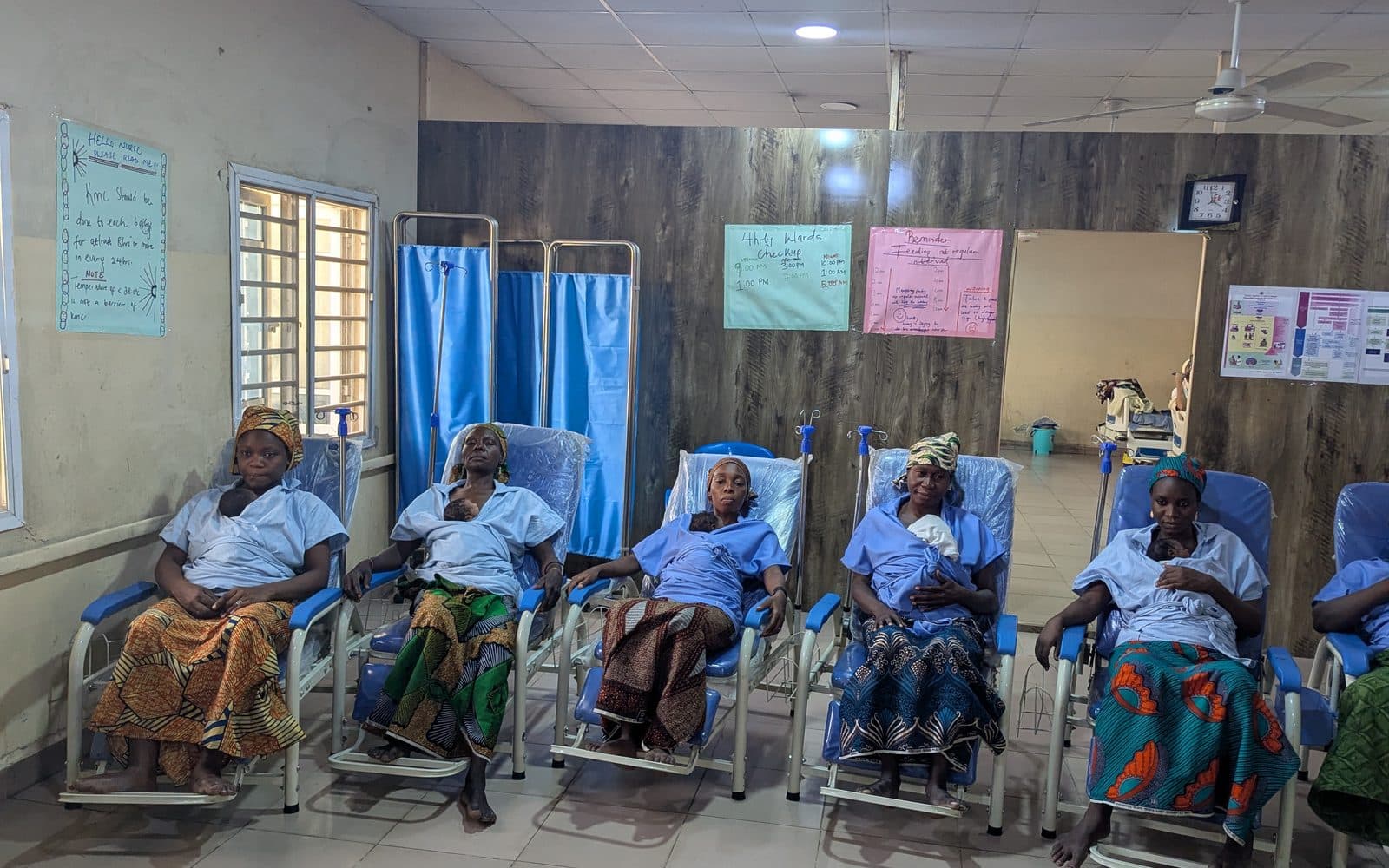 Mothers holding their newborns in Kangaroo Care across the ward in Kano